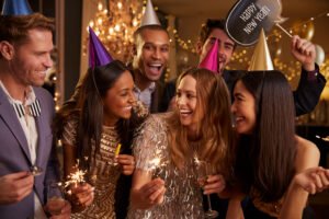 Group Of Friends Celebrating At New Year Party Together