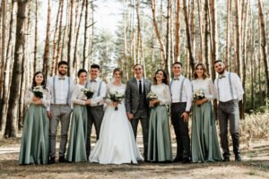 newlyweds with friends and friendships,witnesses at the wedding,wedding day of the bride and groom,cheerful groom with the bride and a group of witnesses are photographed in the forest,